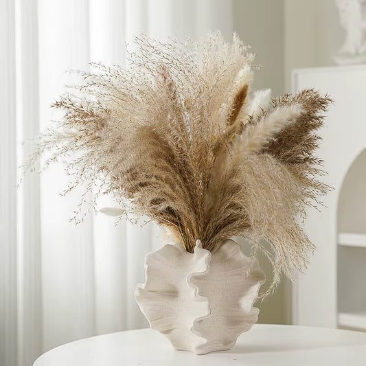 Beige coral vase with dried pampas grass