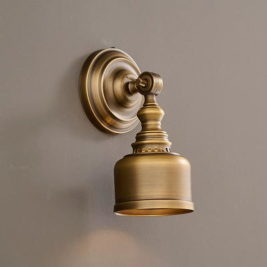 Brass wall sconce with brass shade and short arm