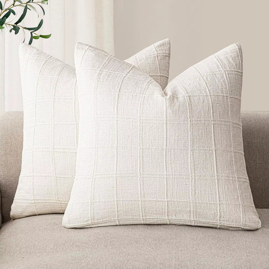 Cream chenille throw pillow covers on a sofa