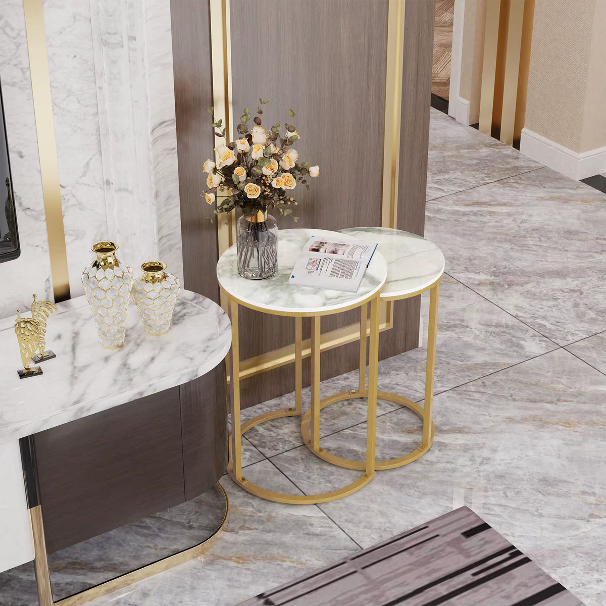 Nesting side tables with white tops and gold frames beside a console in a marble-floored room.