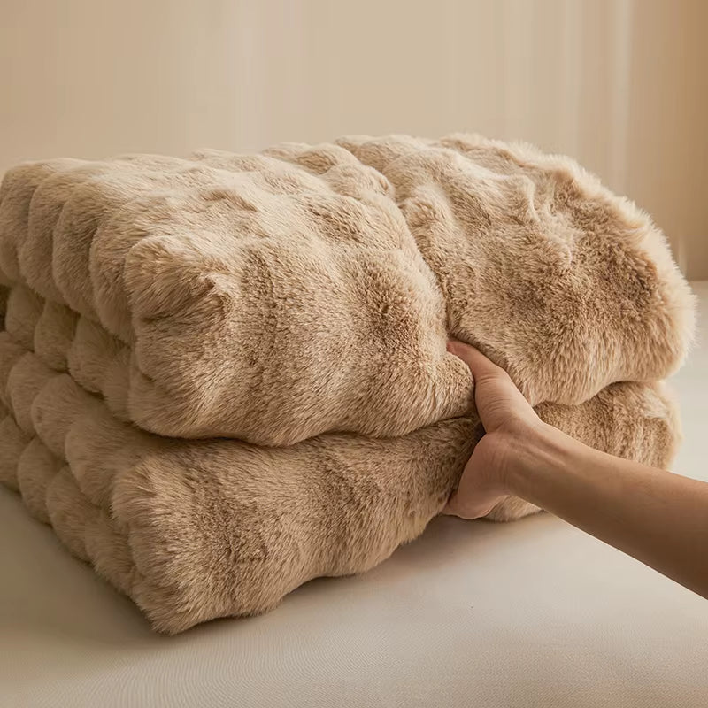 Faux rabbit fur throw, folded