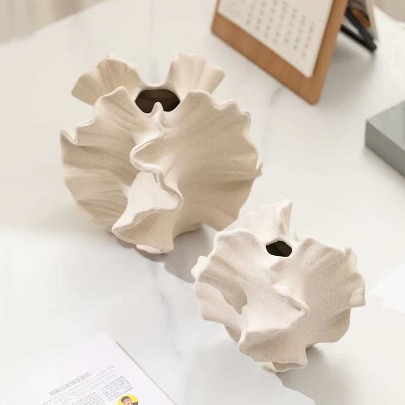 Small and large wave vases side by side