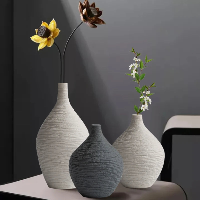 Beige and grey bud vases with stems