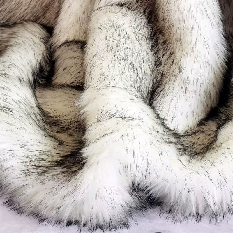 White faux fur throw with a milk velvet back