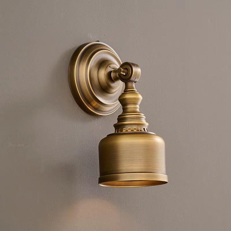 Brass wall sconce with brass shade and short arm