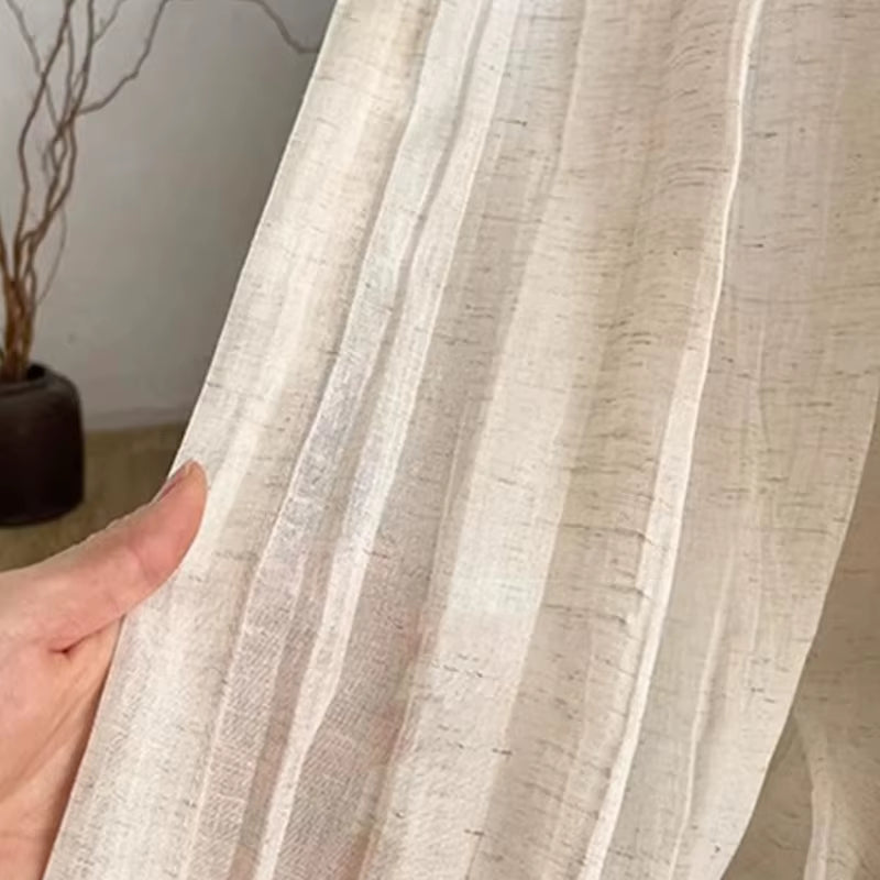 White tie-top curtain panel with a wrinkled linen-look texture