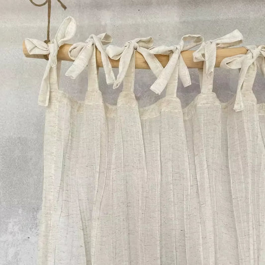 White tie-top curtain panel with a wrinkled linen-look texture