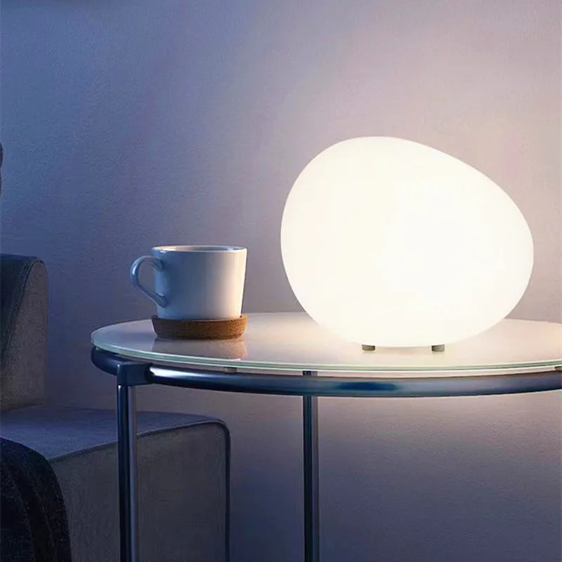 Cobblestone table lamp lit in one of its three light colors