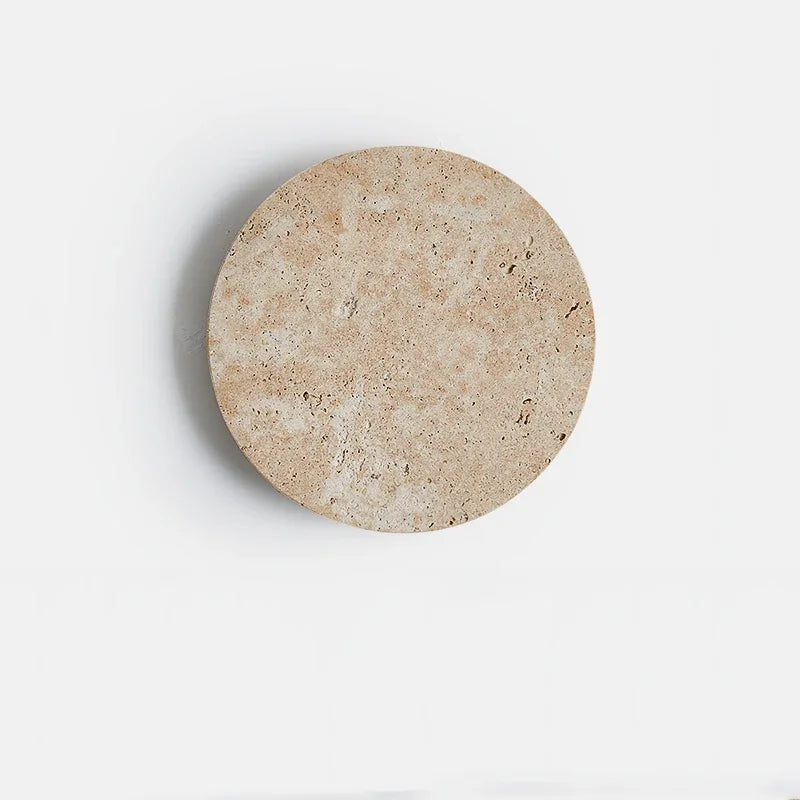 Front of the round yellow cave stone sconce