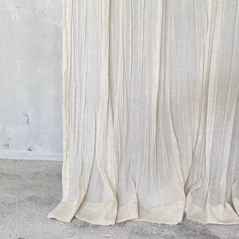 White tie-top curtain panel with a wrinkled linen-look texture