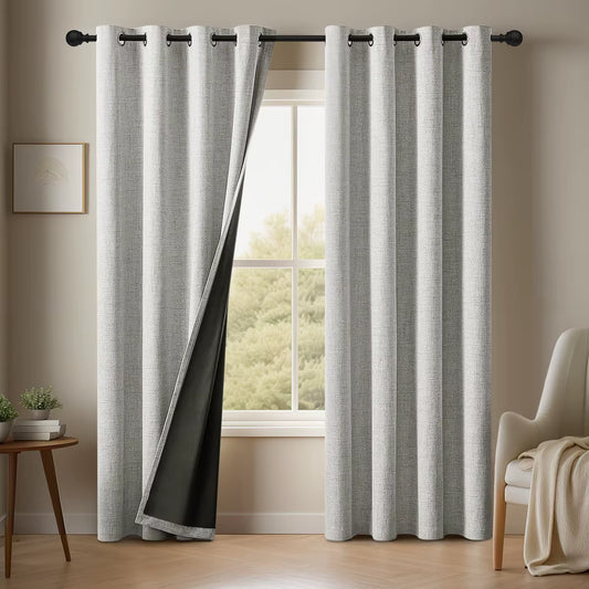 Beige linen-look blackout curtains with grommet top in a bedroom