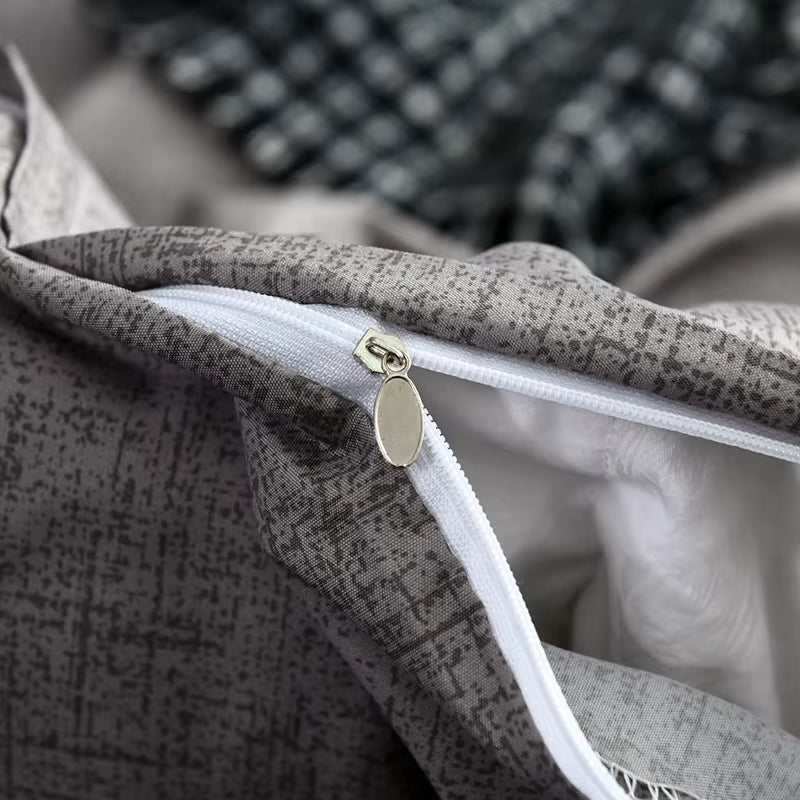 Close view of the zipper closure on the grey duvet cover.