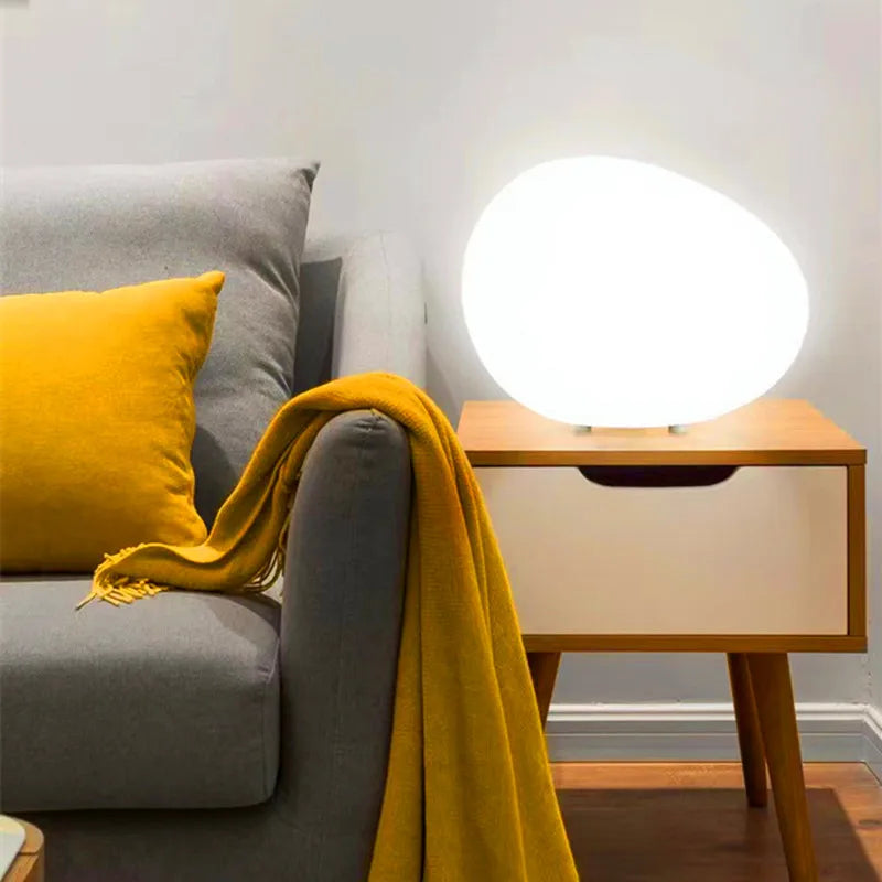 Smooth pebble-shaped lamp with a soft inner glow