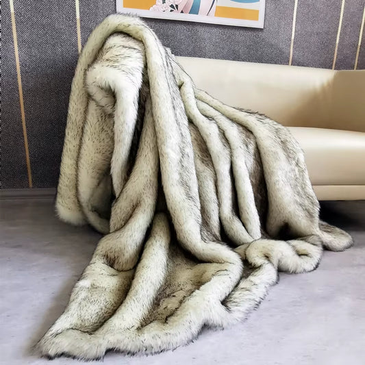 White faux fox fur throw draped on a bed or sofa