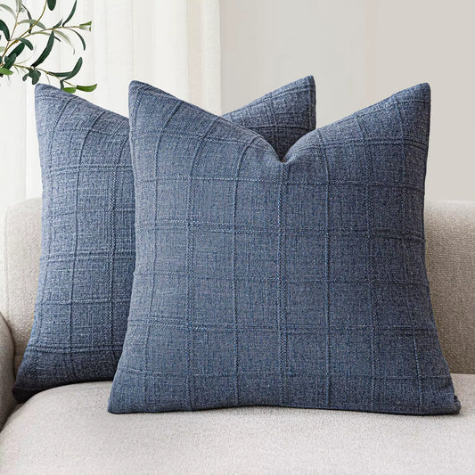 Navy chenille throw pillow covers on a sofa