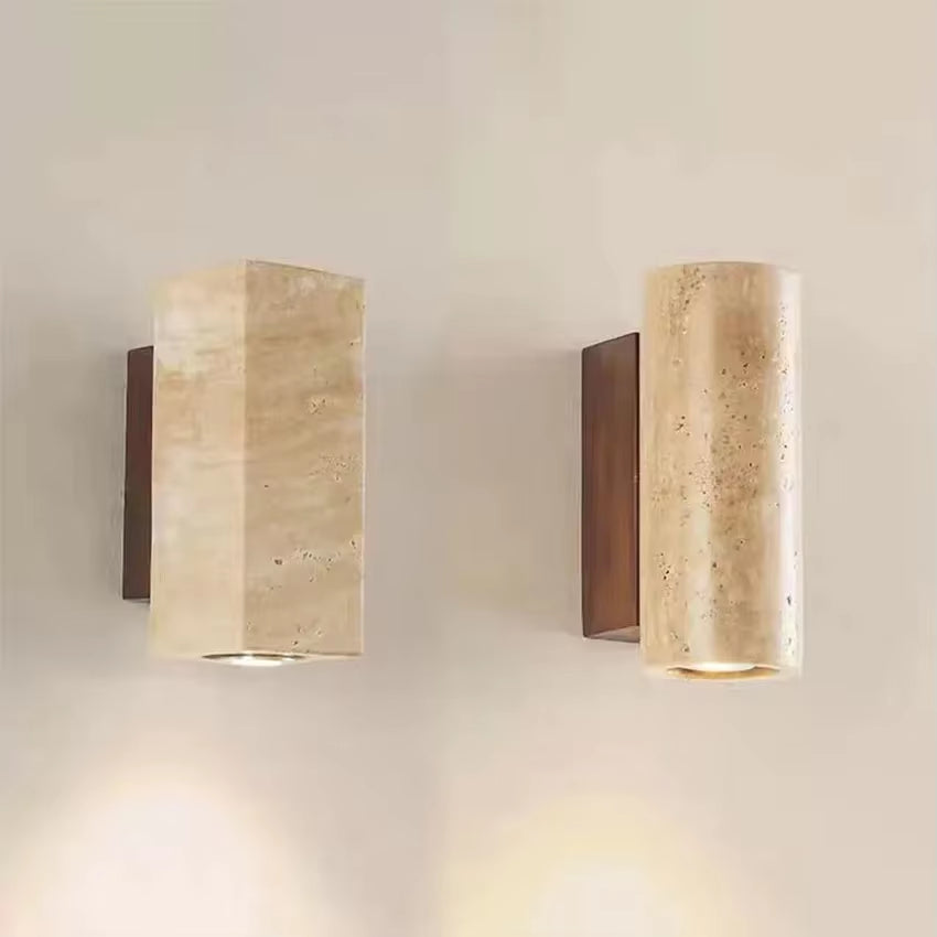 Small travertine wall sconce with a walnut-color base, side view