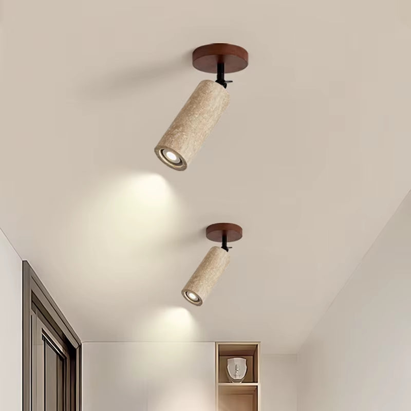 Two travertine ceiling spotlights lit on a hallway ceiling