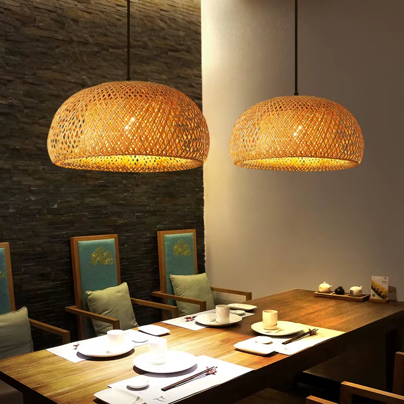 Two dome bamboo pendant lights over a wooden dining table