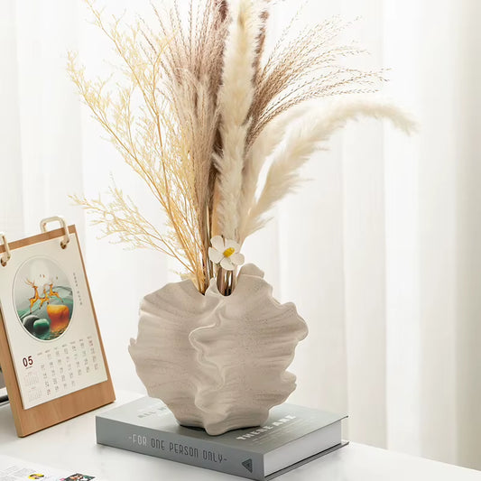 Wave vase with dried pampas grass on a side table