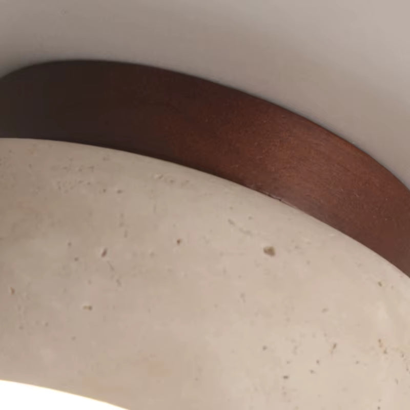 Close view of the dark wood canopy against the travertine shade