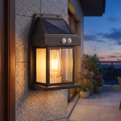 Solar Motion Sensor Wall Light — exterior stone house wall near a balcony entrance at dusk — real-scene lifestyle v4