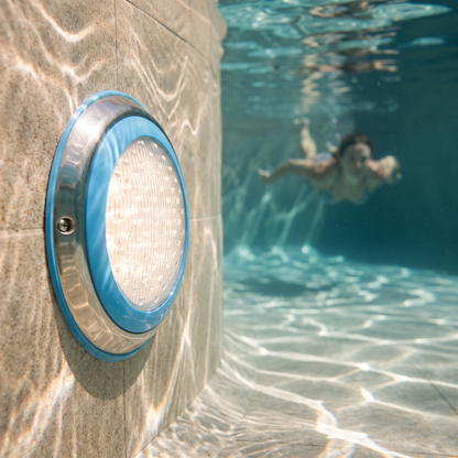 LED Underwater Pool Light — submerged on a real swimming pool wall — real-scene lifestyle v4