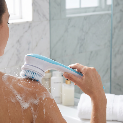 Exfoliating Body Brush — bright marble bathroom shower/vanity area — real-scene lifestyle v4