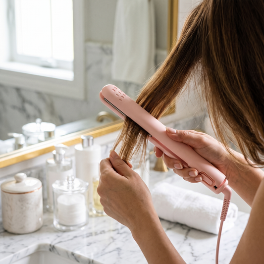 Straightening and Curling Hair Styler — bright marble bathroom vanity — real-scene lifestyle v4