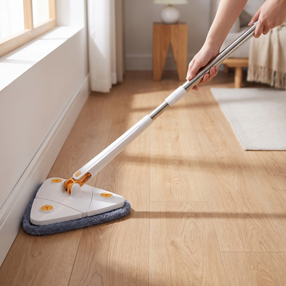 Triangular Spin Mop — home living-room floor near a window/corner — real-scene lifestyle v4